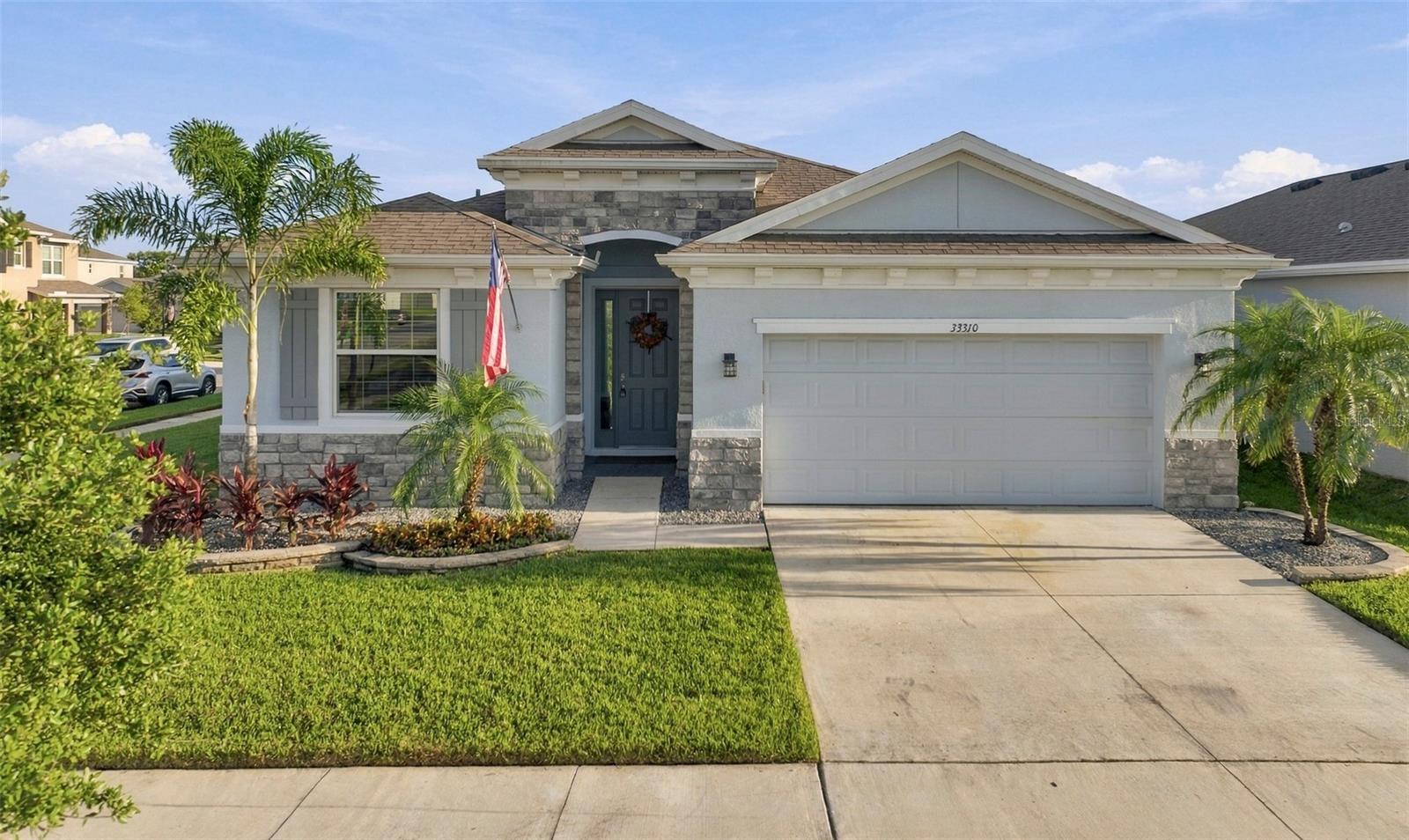 Beautiful Front Exterior with Attractive Landscaping and Extended Driveway Beautiful Front Exterior with Attractive Landscaping and Extended Driveway