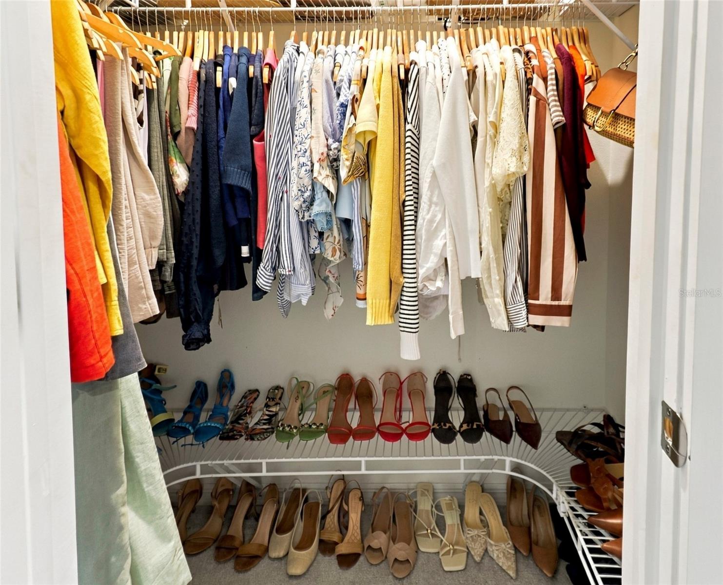 Spacious Walk-In Closet For Her with Built-In Shelving