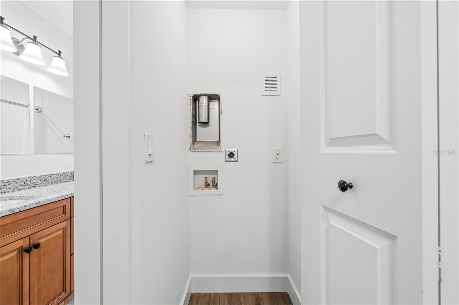 Laundry Closet in Primary Bedroom