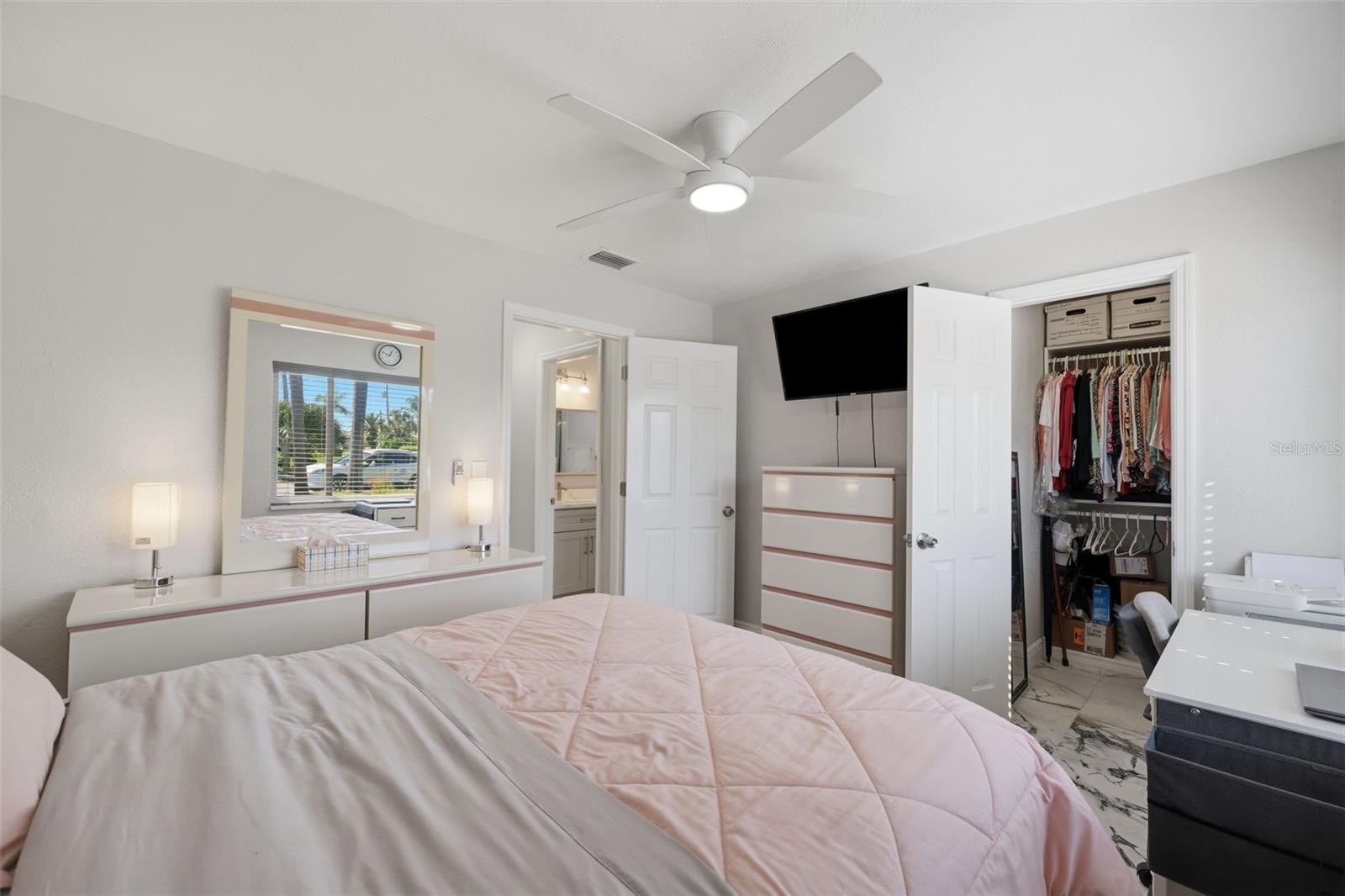 Guest bedroom with large custom closet