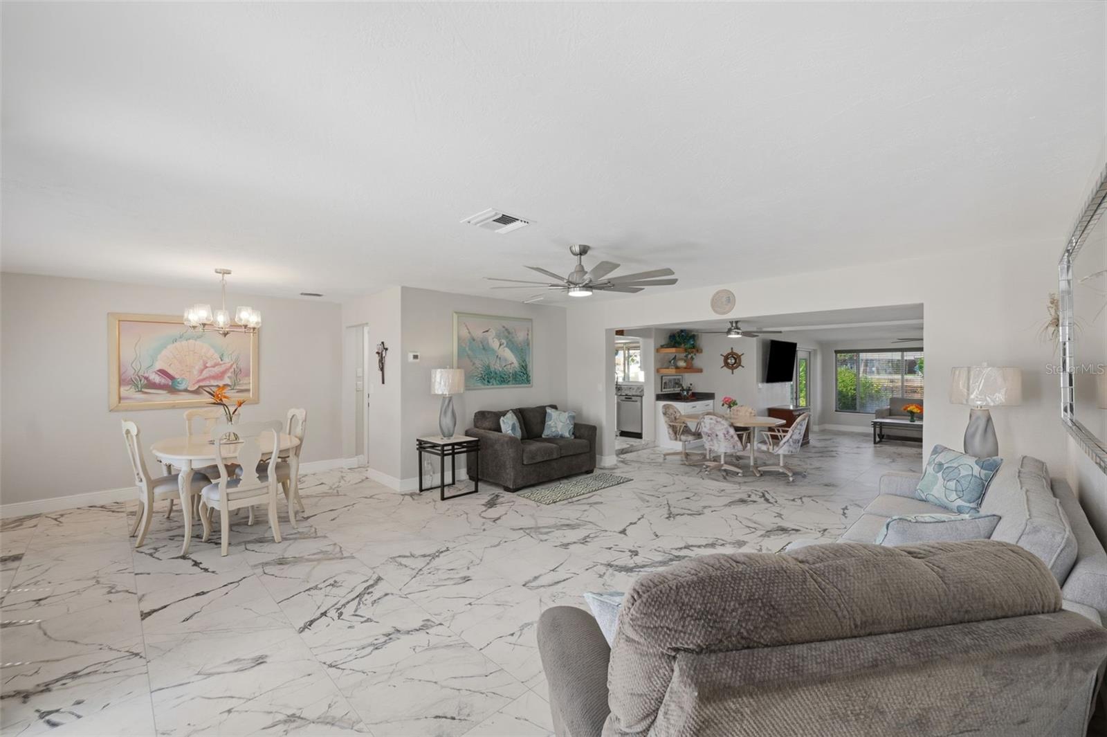 Updated lighting + fans. Spacious open floor plan.