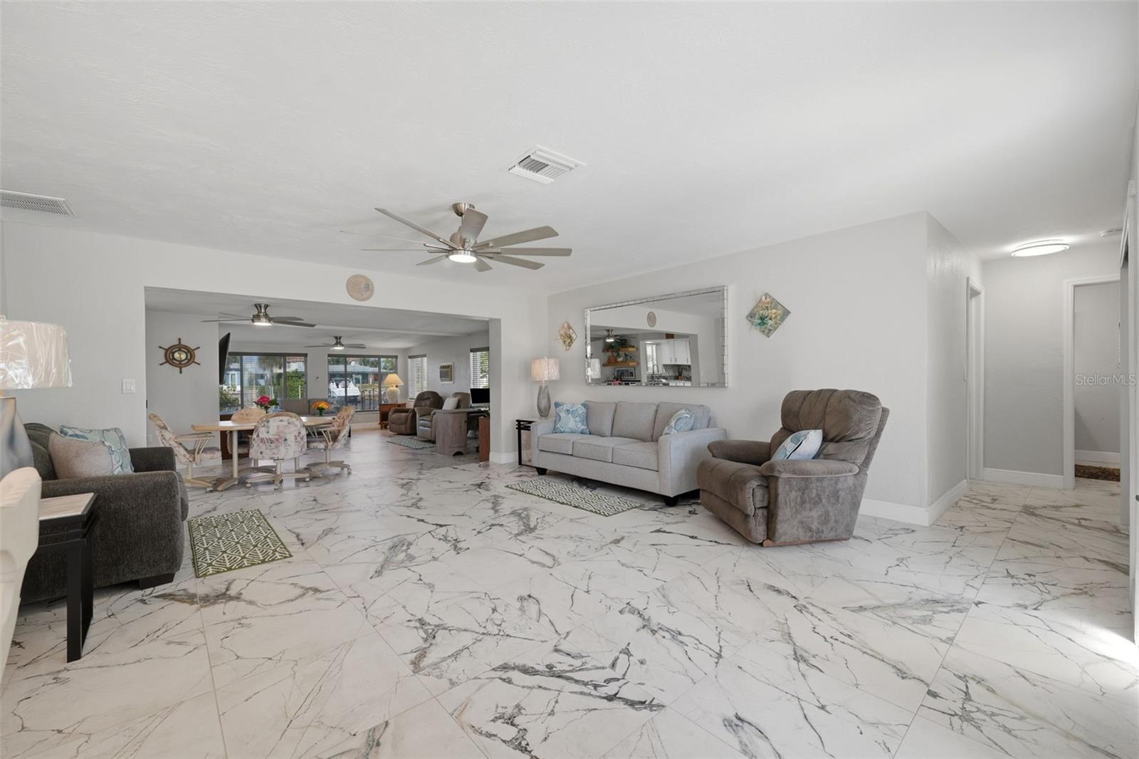 2 living areas | 2 dining areas - sunken family room.  Water view upon entering home
