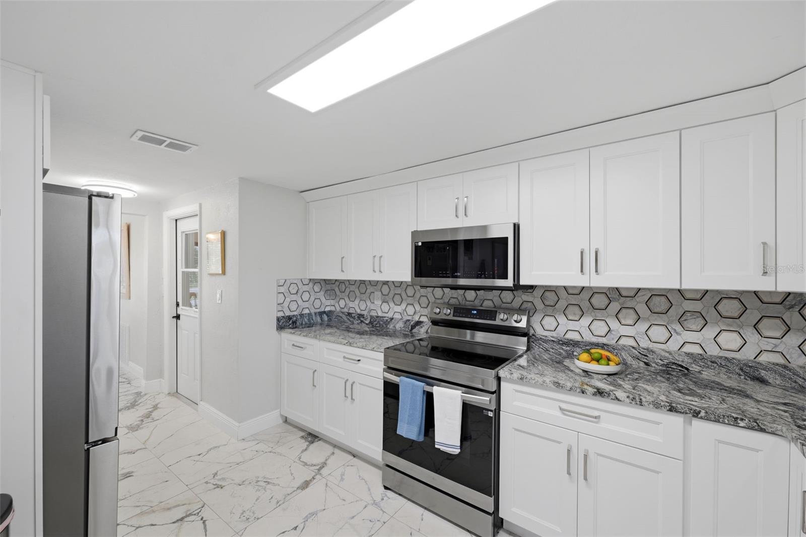 Abundant counter space.  Designer pantry.  New Samsung appliance pkg.
