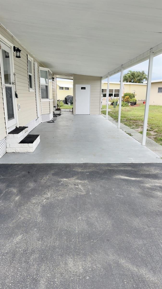 Long carport holds 2 vehicles easily