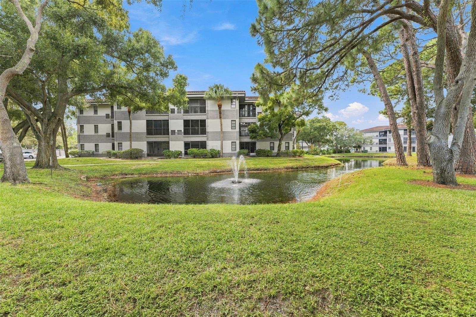Peaceful community pond offering beautiful water views