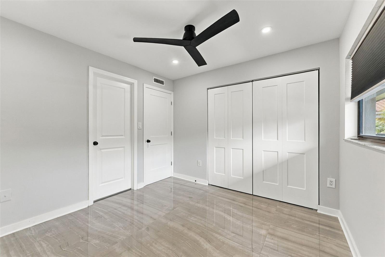 Generously sized bedroom two with a convenient built-in closet