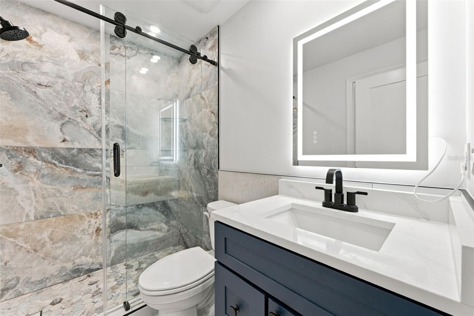 Completely remodeled hall bathroom with beautiful modern finishes