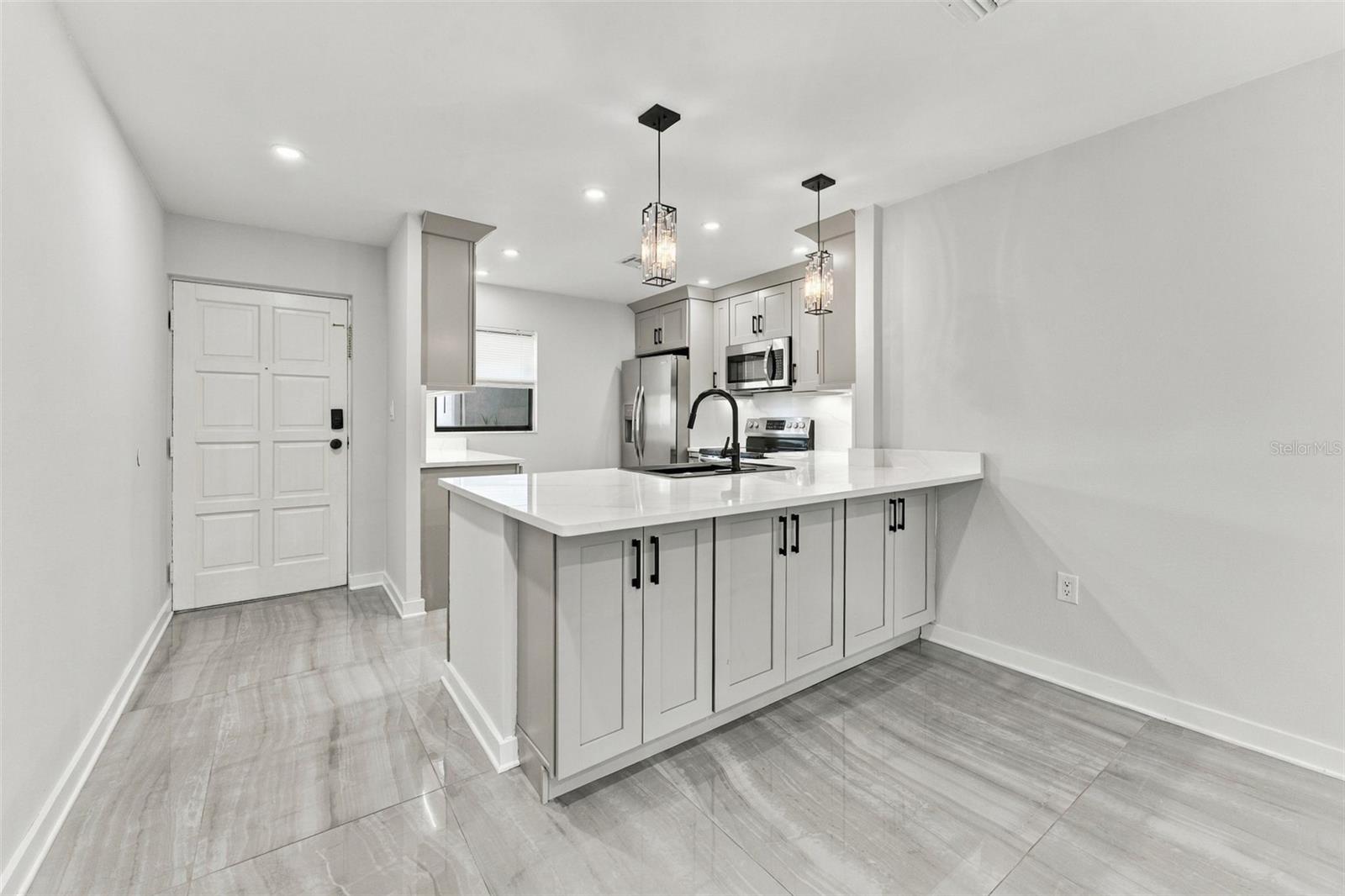 Front entry with the beautifully remodeled kitchen