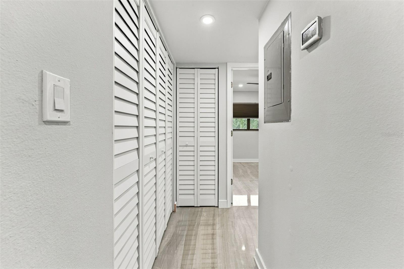 Hallway leading to bedroom two and the beautifully remodeled hall bathroom