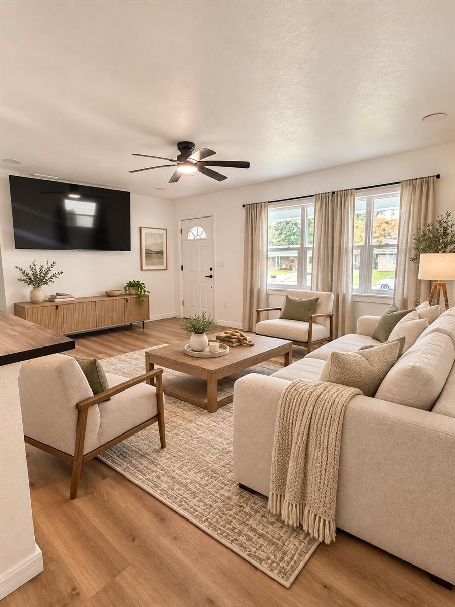 Virtually staged living room showcasing a comfortable seating arrangement and inviting space for entertaining.