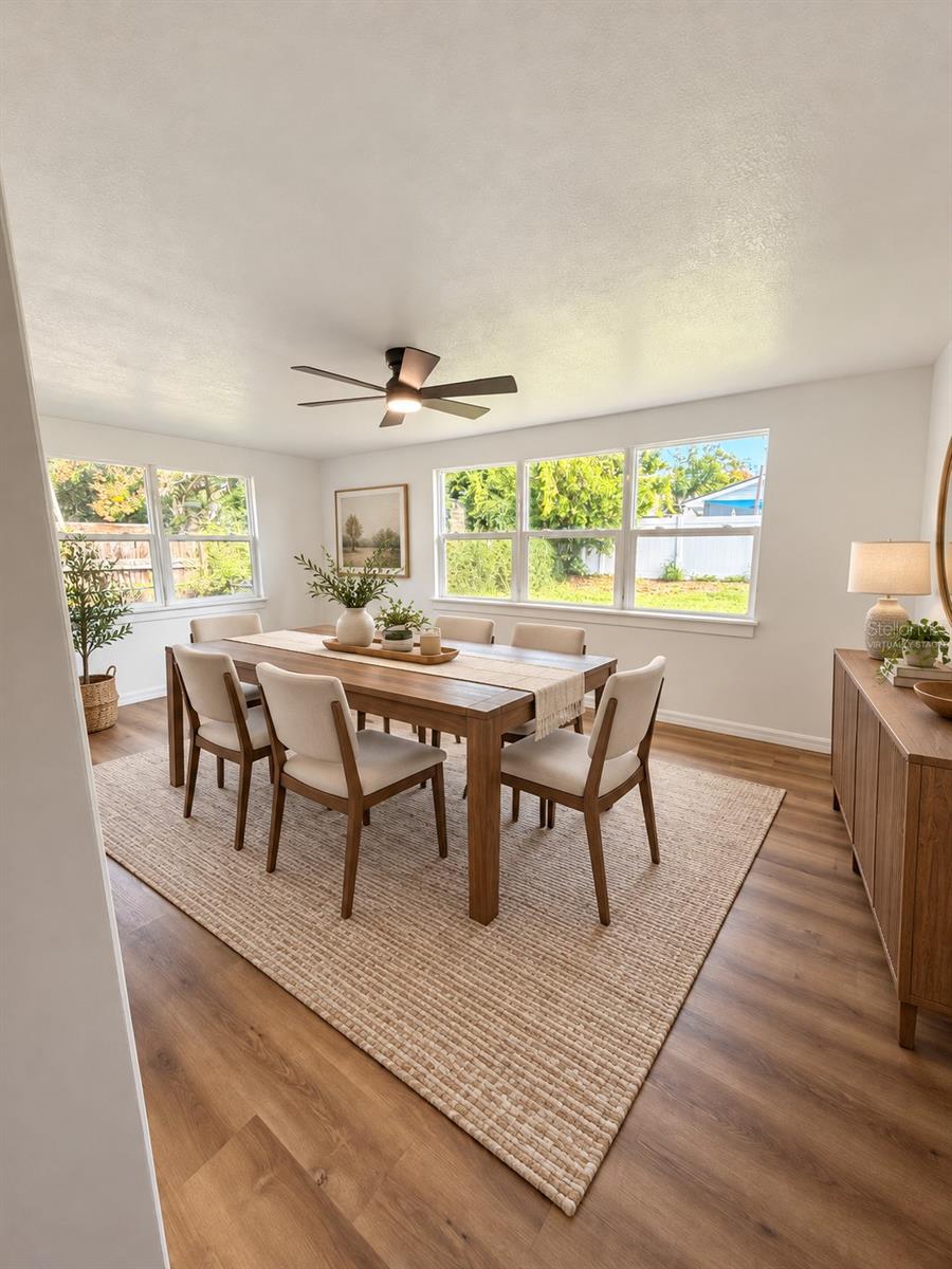 Virtually staged dining room highlighting the space's potential for everyday dining and entertaining.