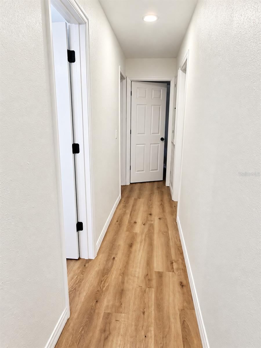 Hallways to the bathrooms and bedrooms