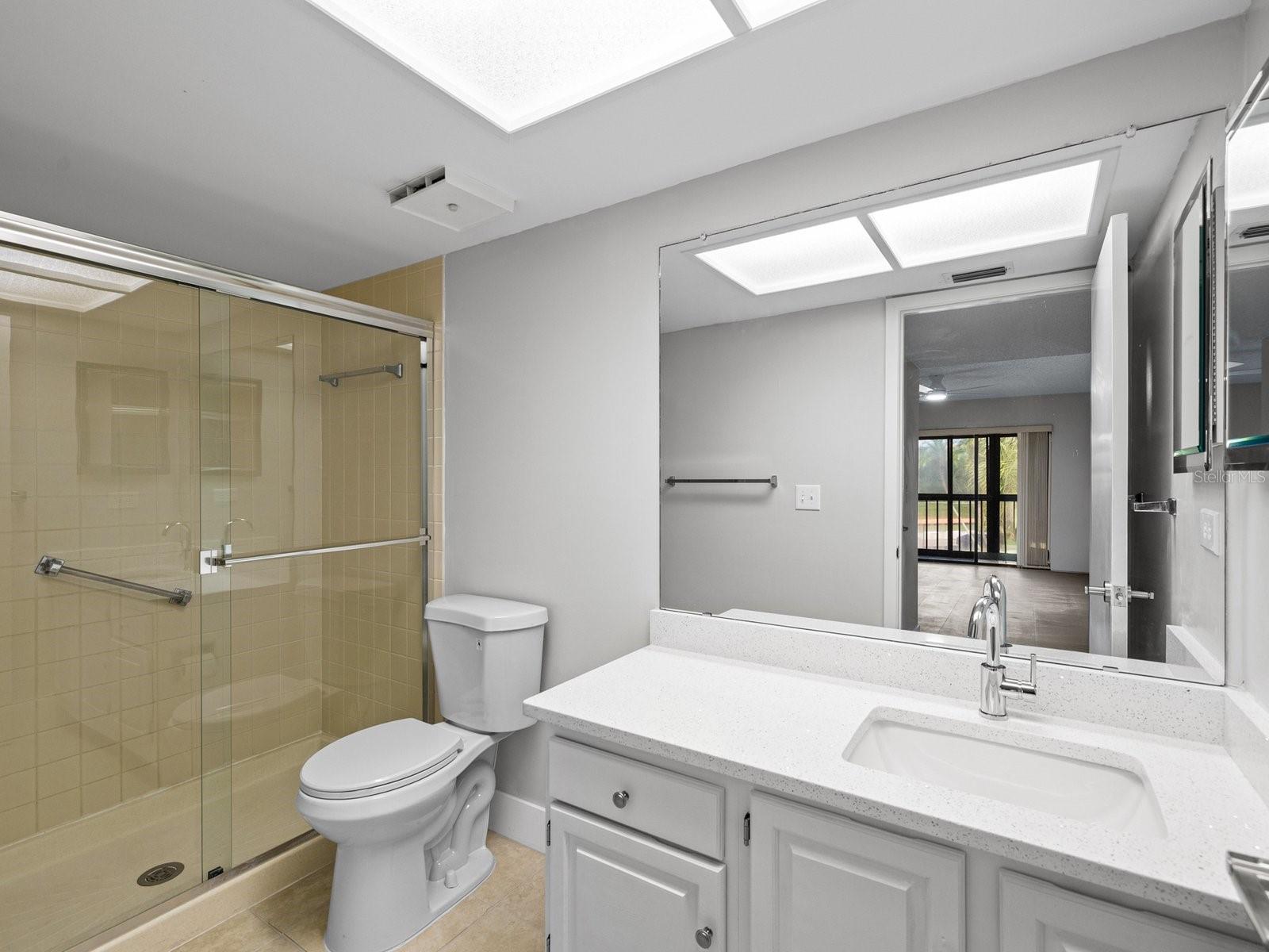 Step in primary shower with glass doors