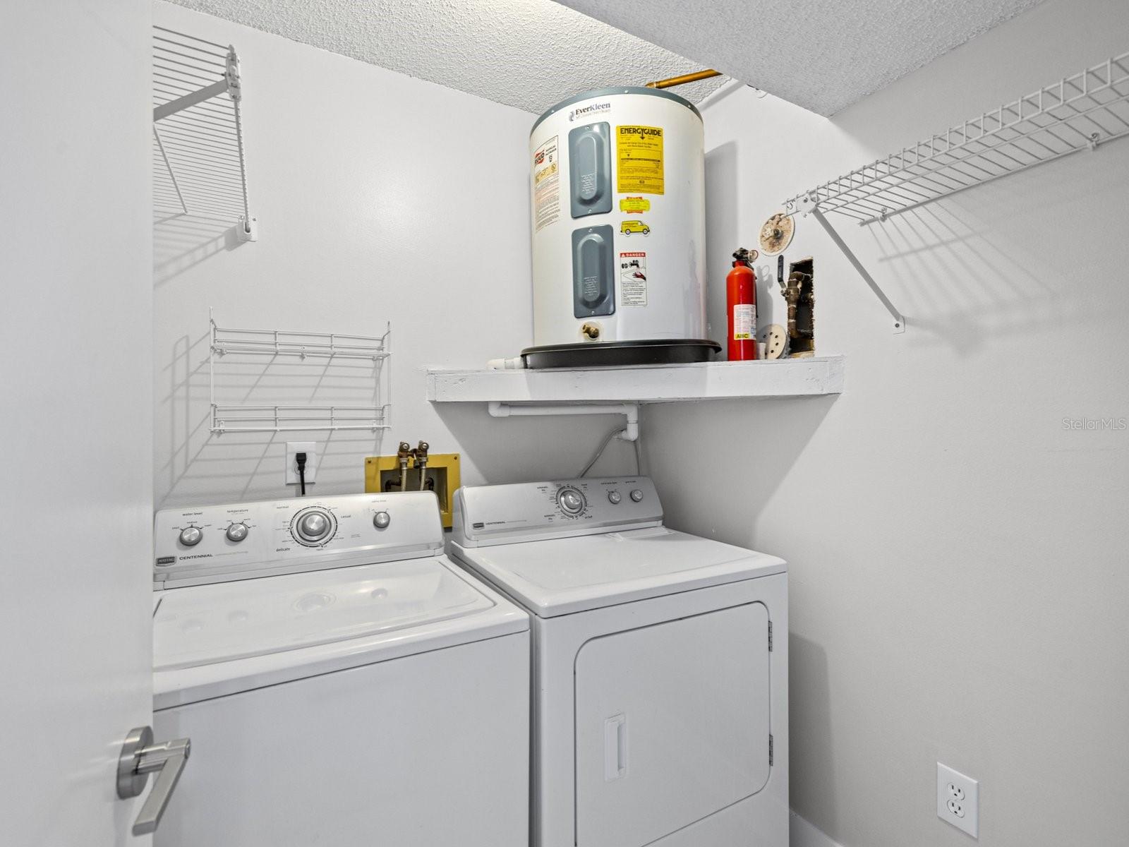 Laundry room off hallway by 2nd bedroom