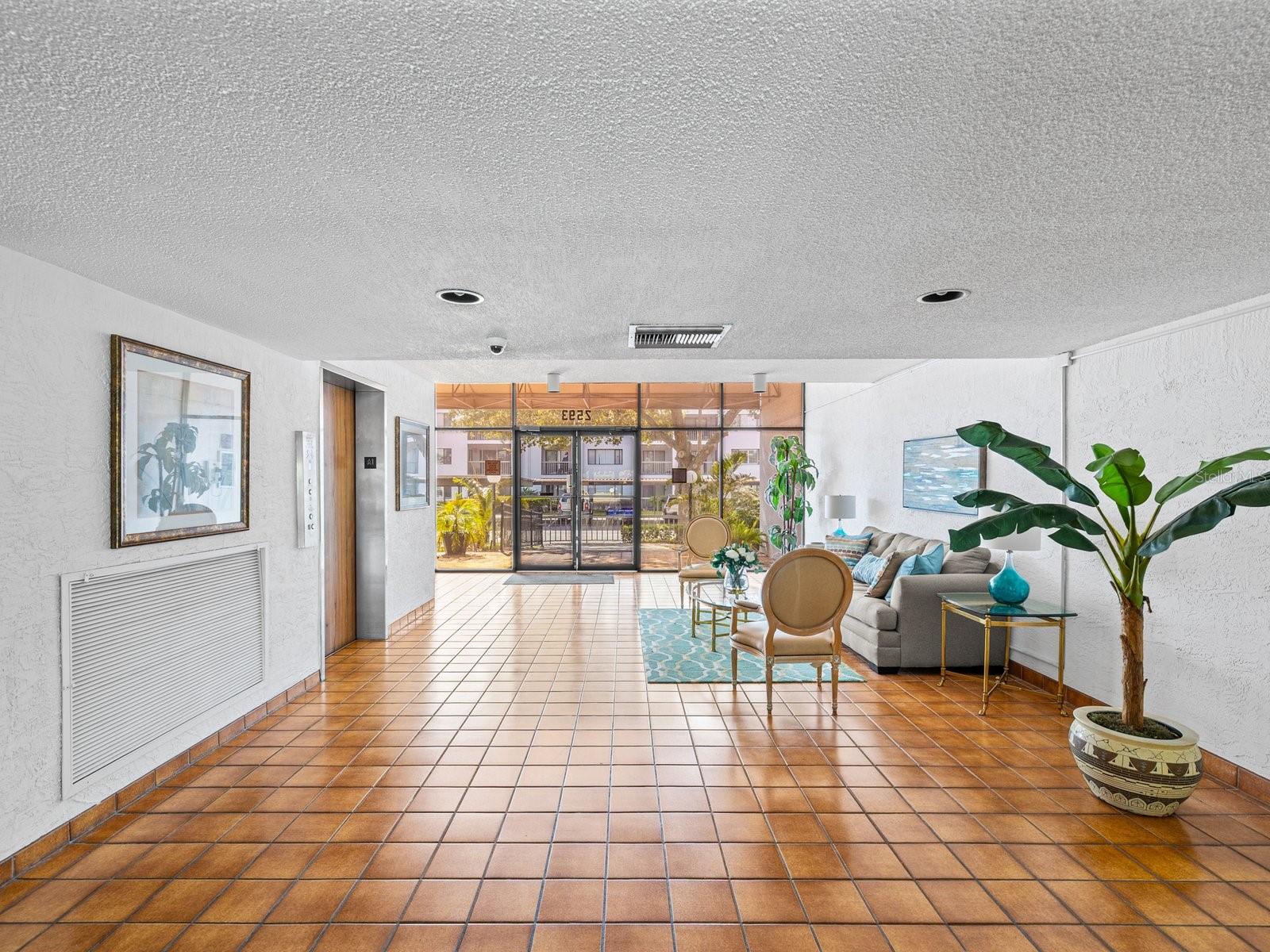 Building entry on main floor is security keyed entry with inviting sitting area and elevator on the left