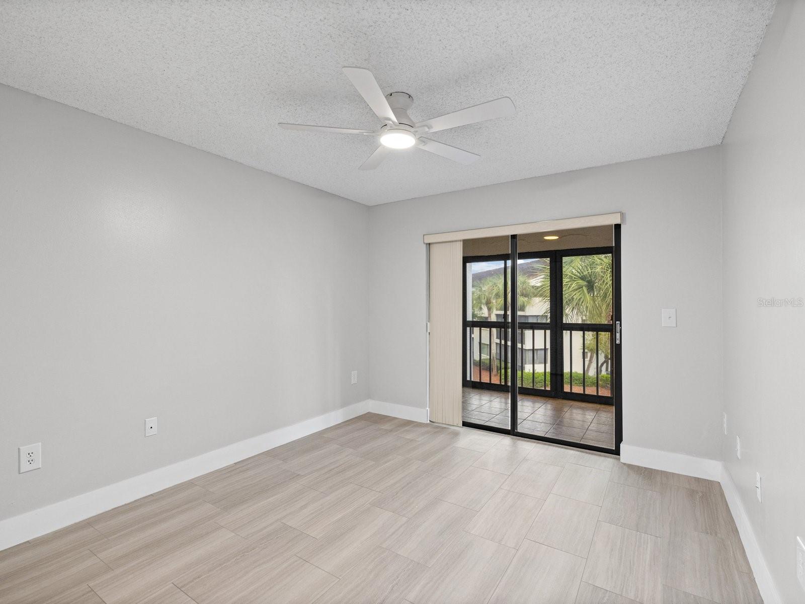 Primary bedroom with views of palms