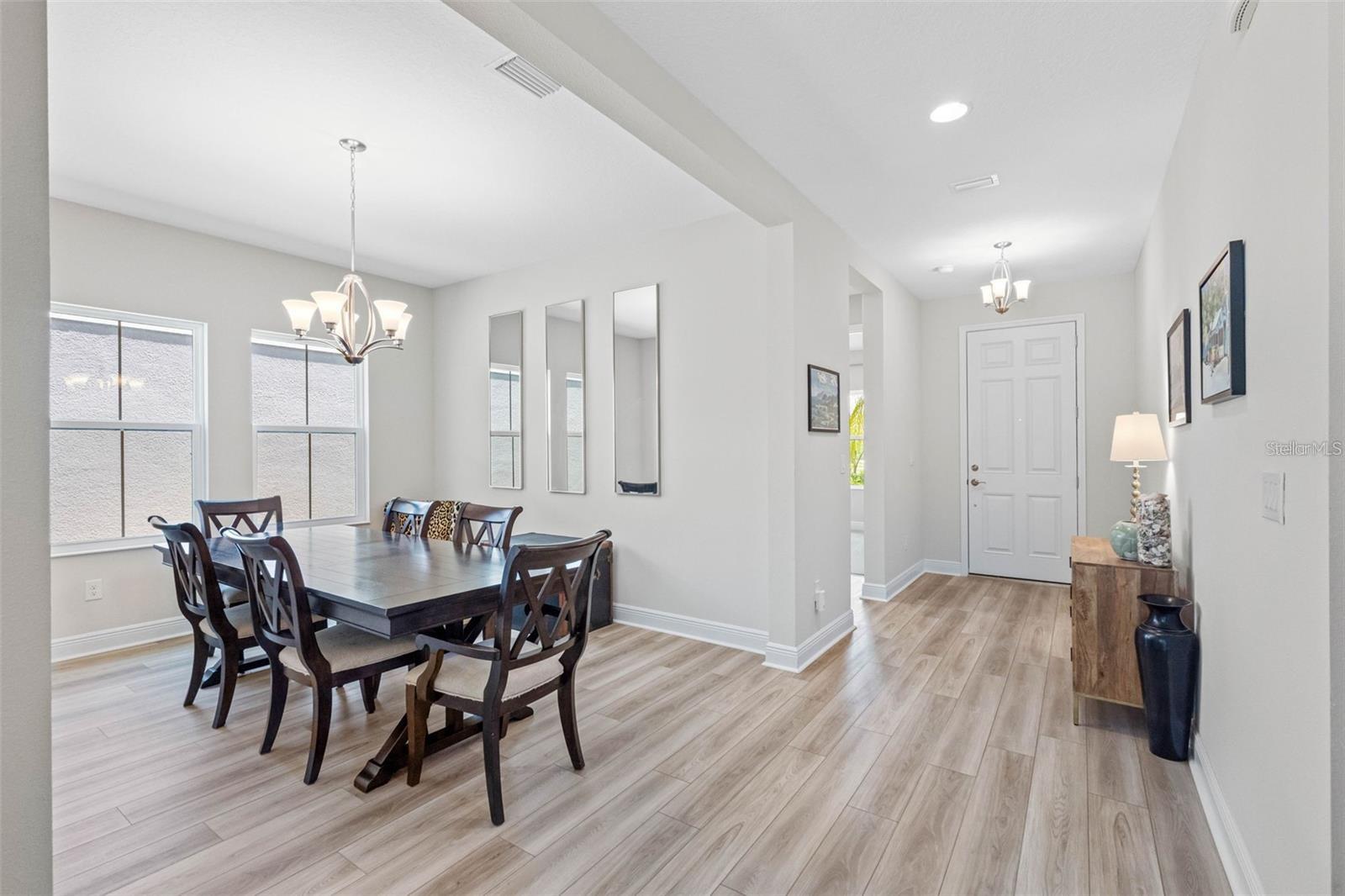Formal dining room and welcoming foyer with luxury vinyl plank floors Formal dining room and welcoming foyer with luxury vinyl plank floors
