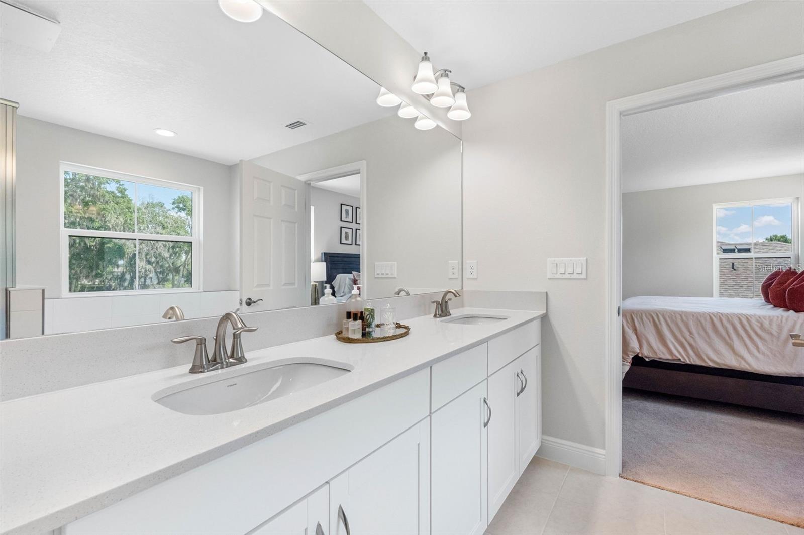 Primary bath with dual sinks and quartz countertops