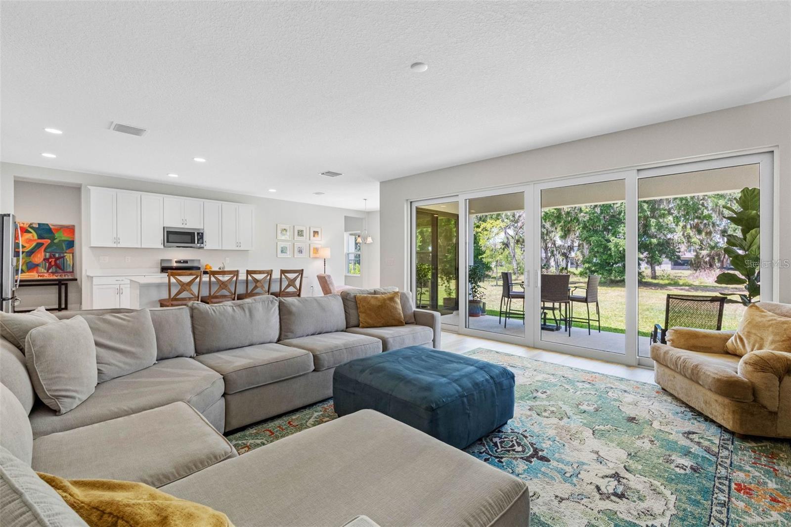 Open great room with a 16-foot sliding glass door to the covered lanai Open great room with a 16-foot sliding glass door to the covered lanai