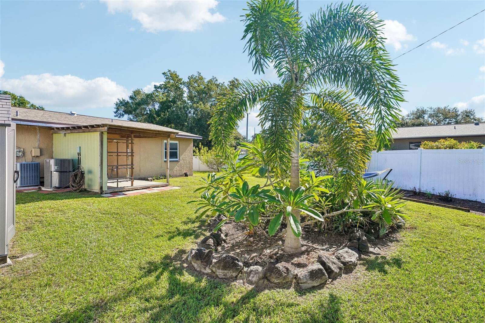 pretty landscaping with privacy fence.