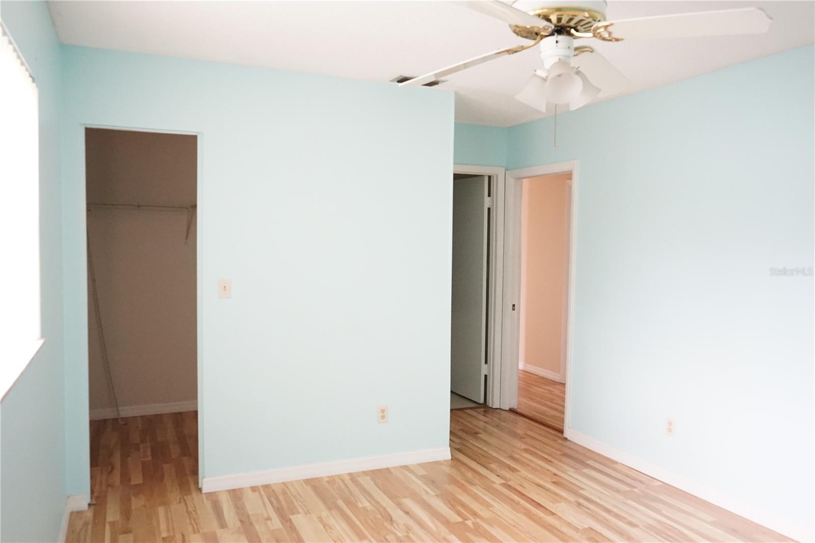 primary bedroom and walk in closet to the left