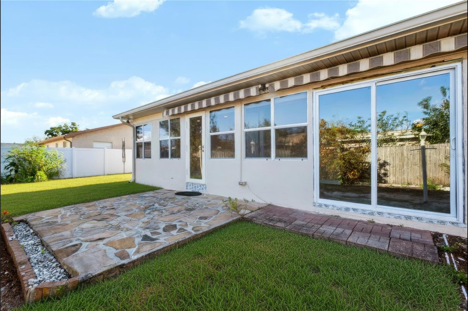 Patio space off of the Florida room in the back yard