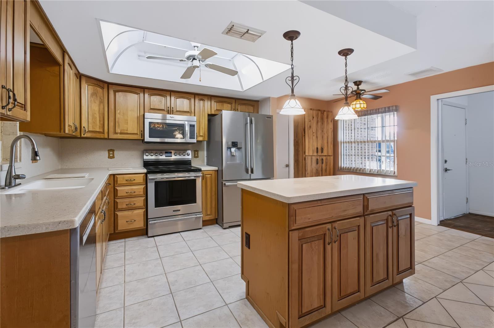 Gorgeous kitchen with Island and bright lighting
