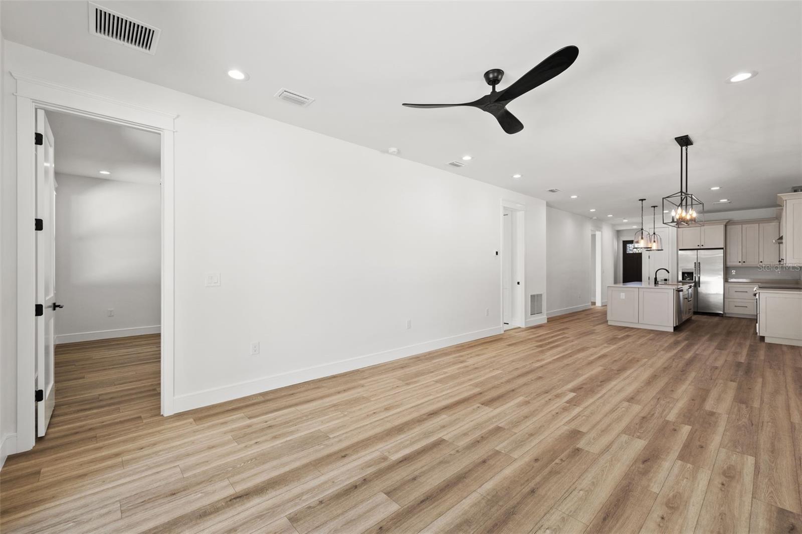 Living room leading to primary suite