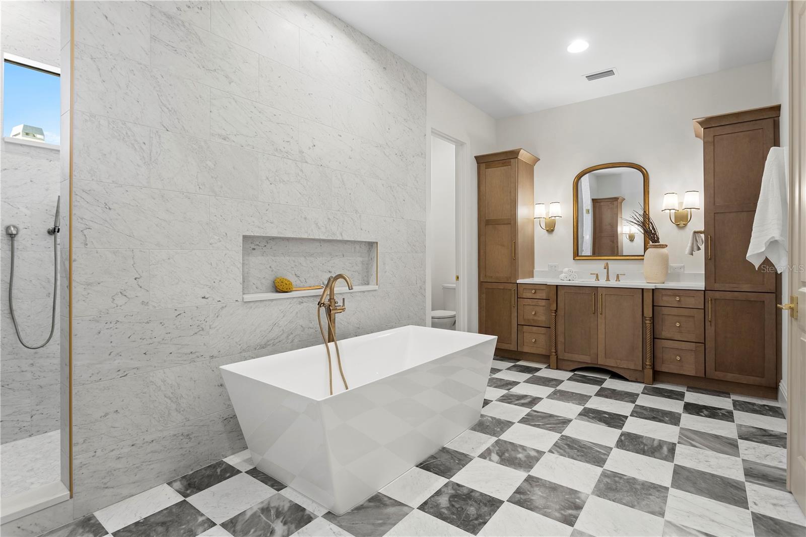 Primary bath with marble floors