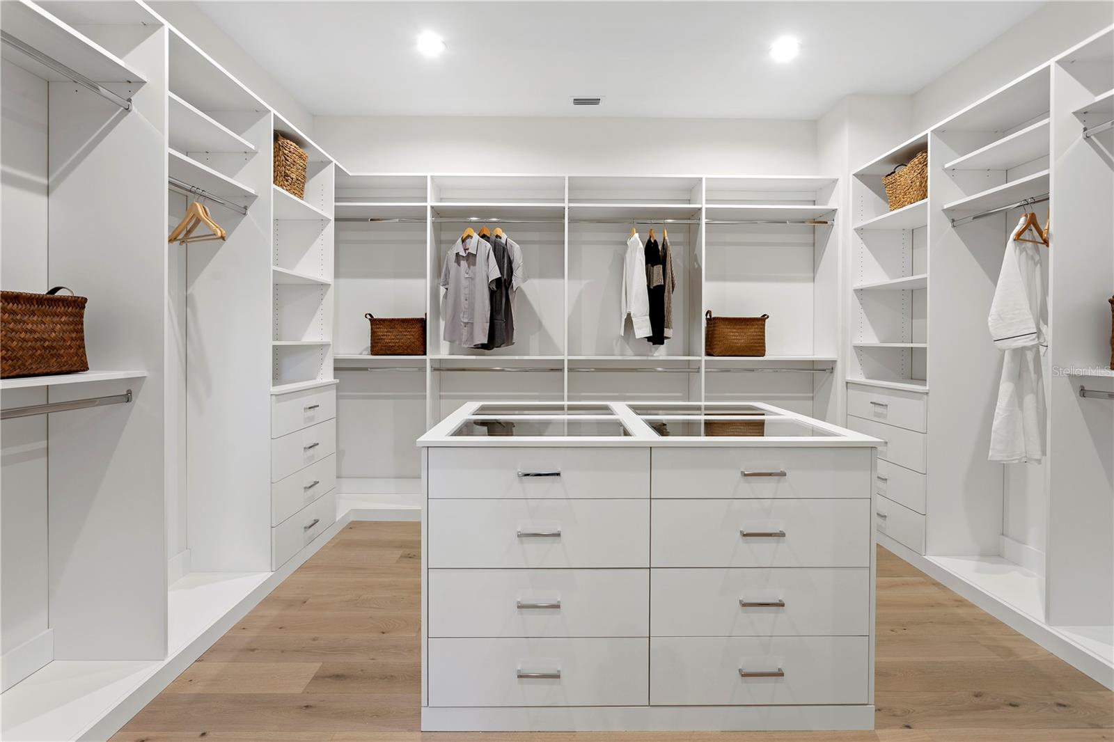 Primary walk in closet with center island