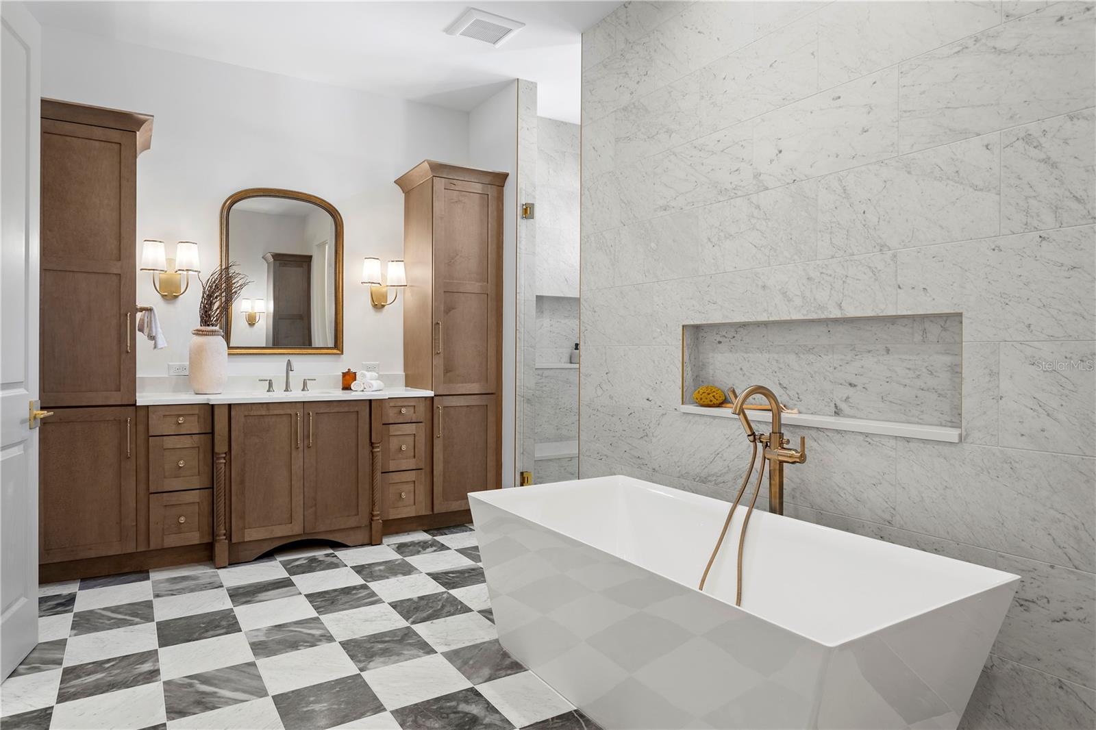 Primary bath with marble floors, soaking tub and large walk in shower Primary bath with marble floors, soaking tub and large walk in shower