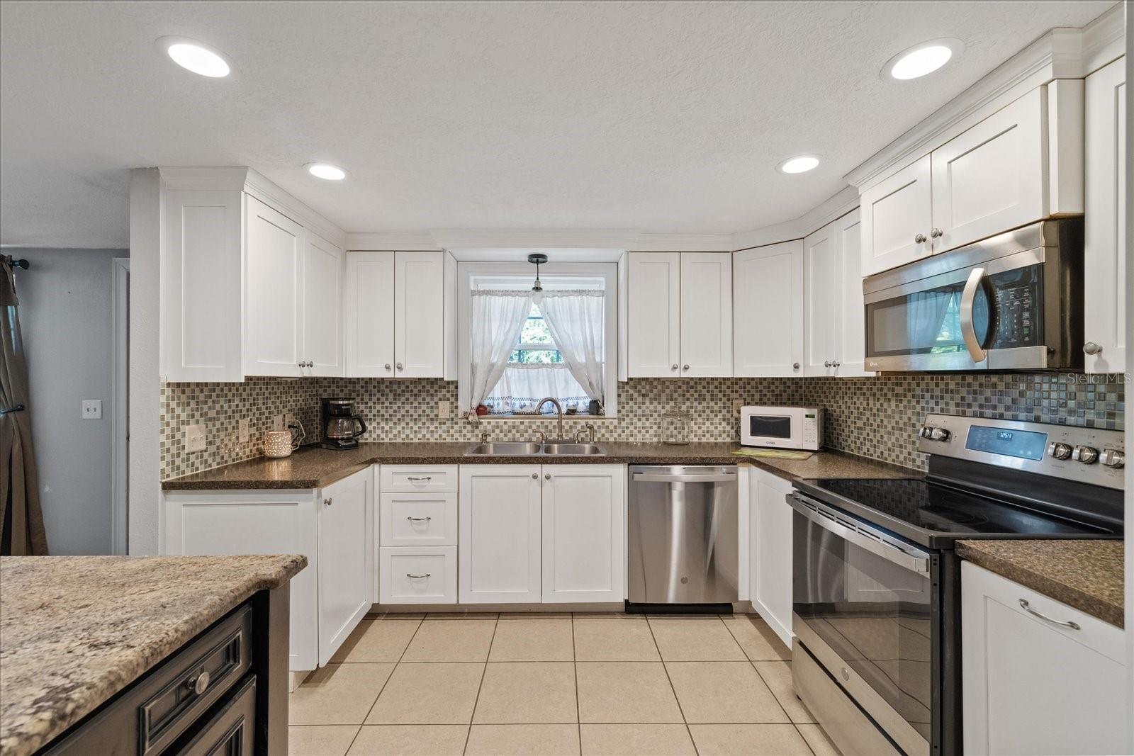 Large open Kitchen with window over the sink Large open Kitchen with window over the sink