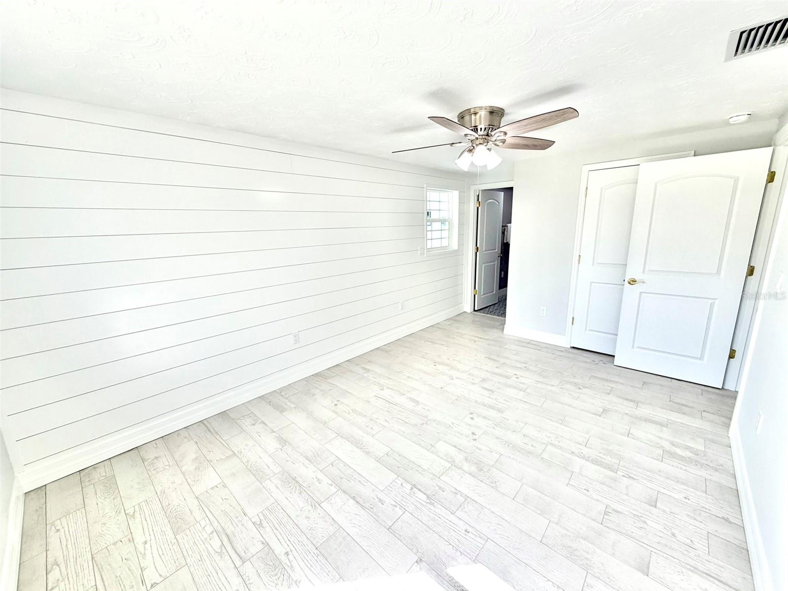 Primary Bedroom with Shiplap Wall