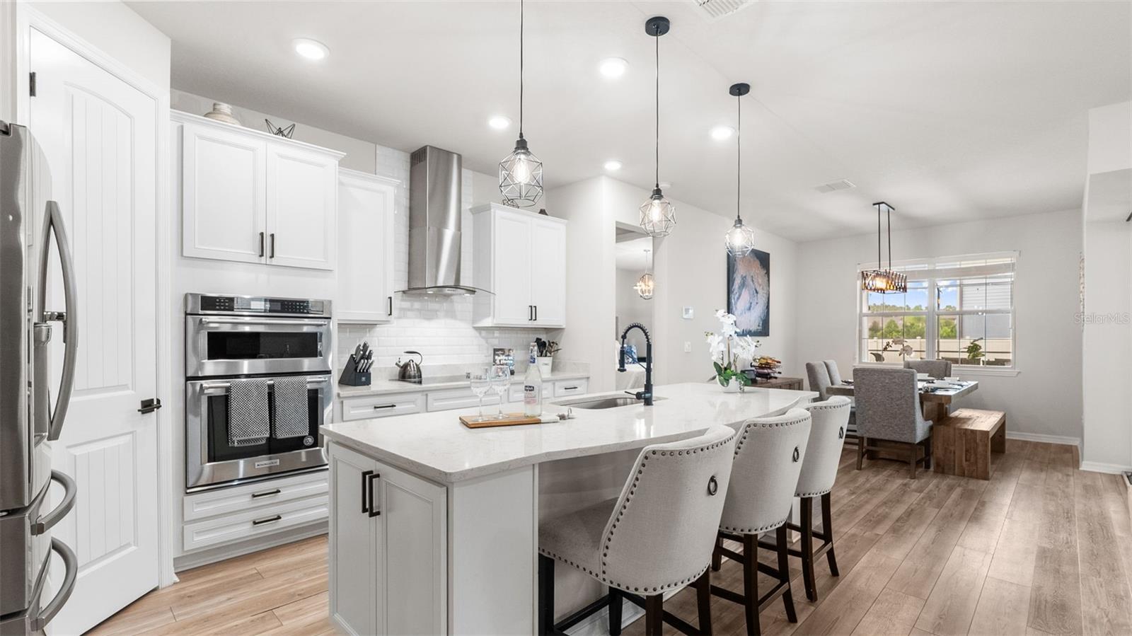 Kitchen: Expansive Island With Seating, Built-In Oven/Microwave, Range Hood, Cooktop