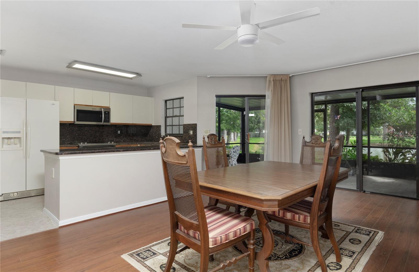 Dining room opens to porch and kitchen.