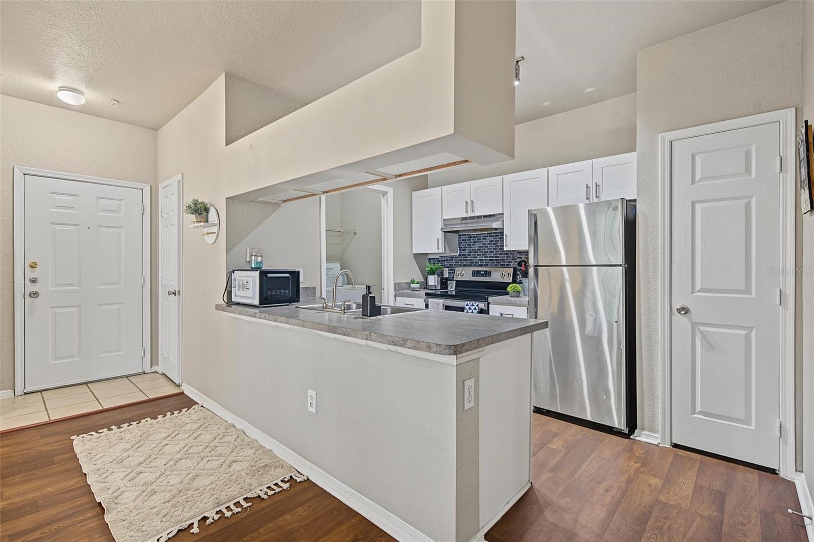 Kitchen Overlooking Living Room - 13123 Sanctuary Cove Drive - Unit 104 Kitchen Overlooking Living Room - 13123 Sanctuary Cove Drive - Unit 104