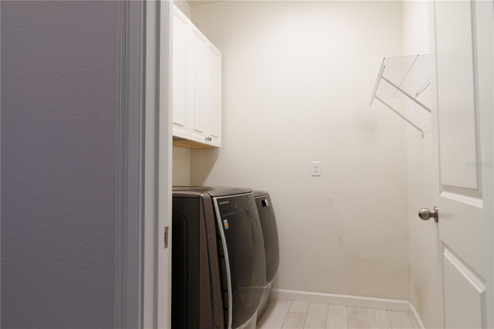 Laundry room with built in cabinets