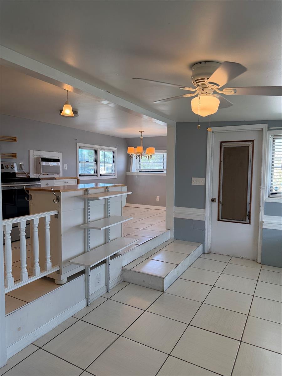 Front door and view into the eat in kitchen.