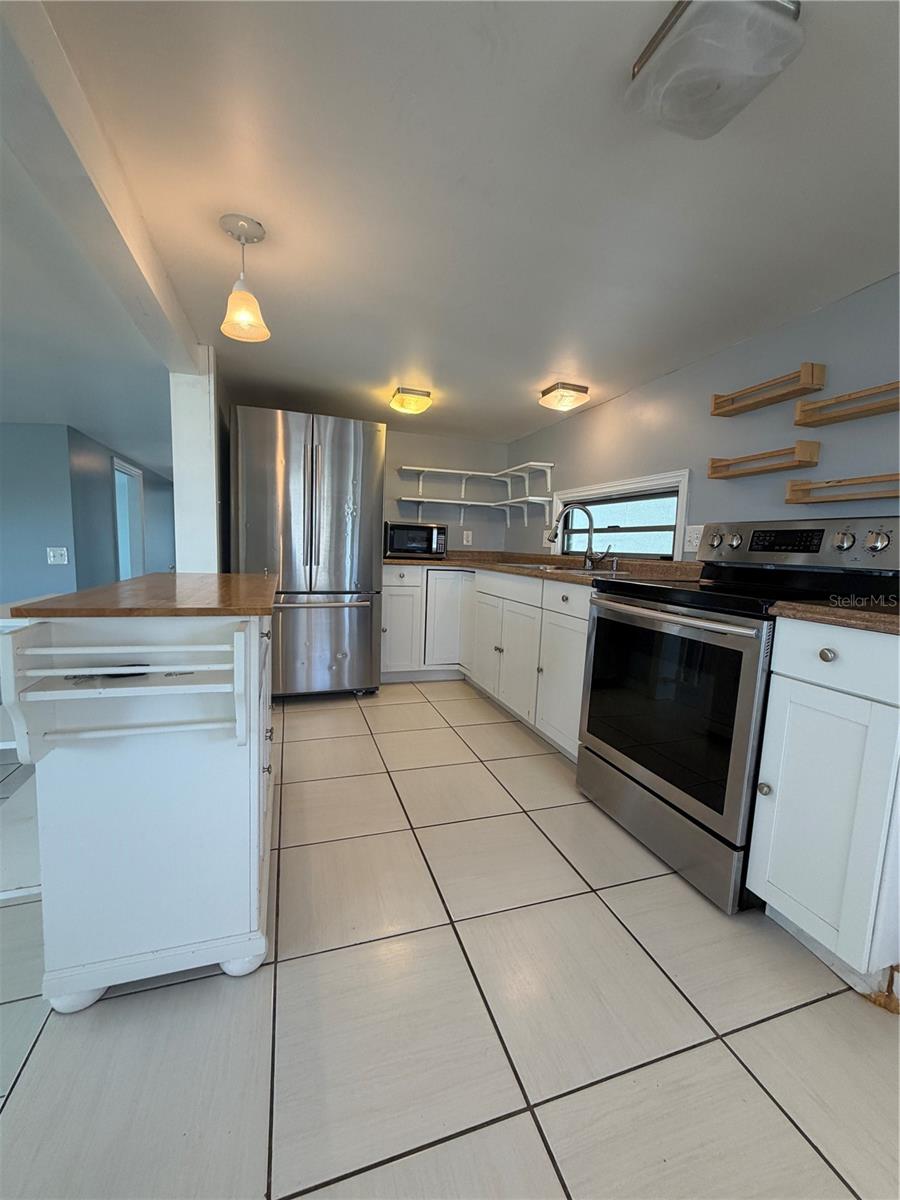 Kitchen with ceramic tile.