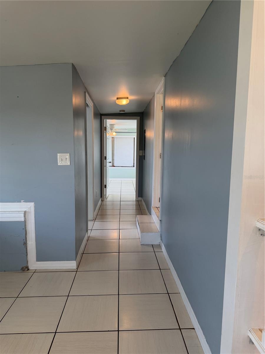 Hallway view to the primary bedroom.