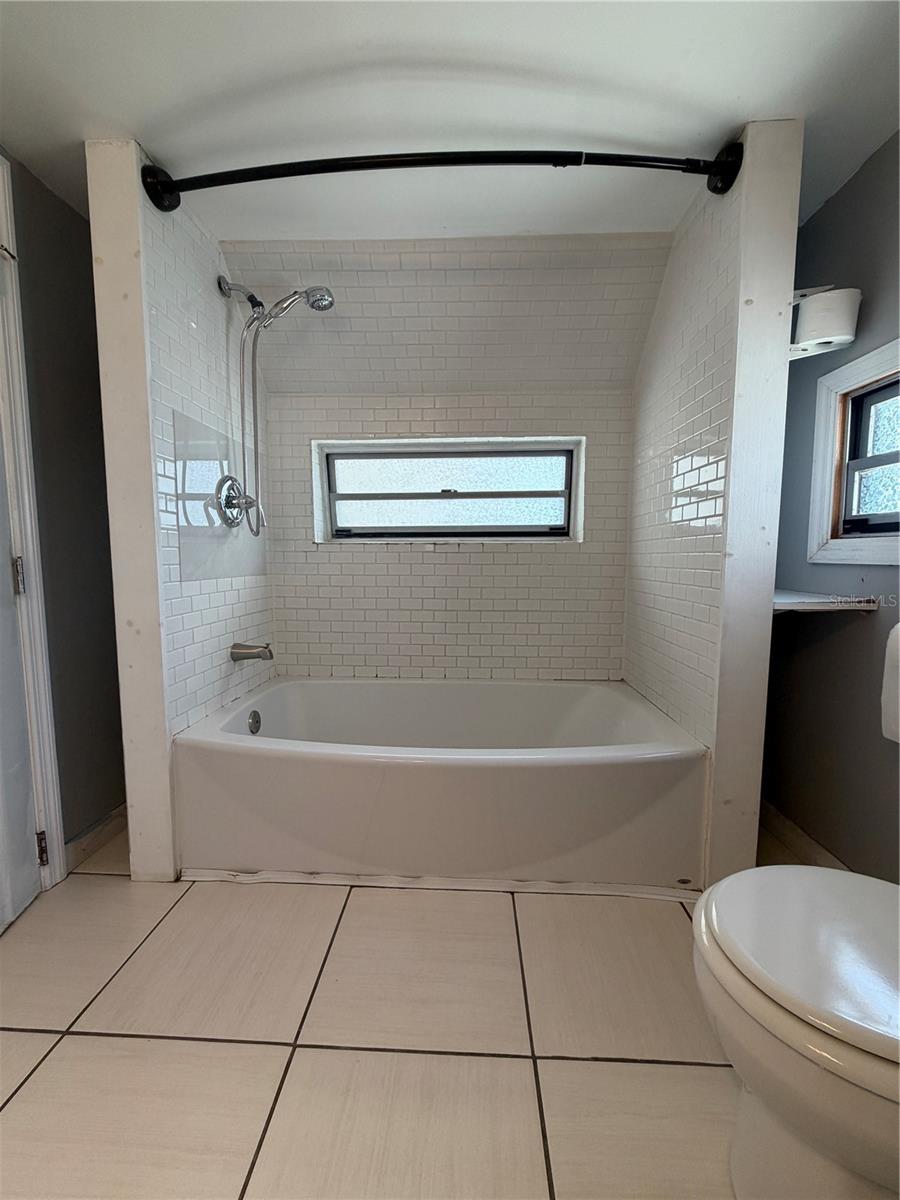 Tub/Shower in bathroom.