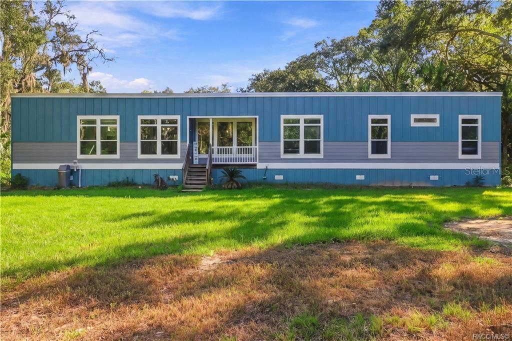 WELCOME HOME TO THE PICTURE-PERFECT COUNTRY SETTING! Attractive blue exterior, crisp white accents & generous green space give this 2024 home a fresh, welcoming appearance.