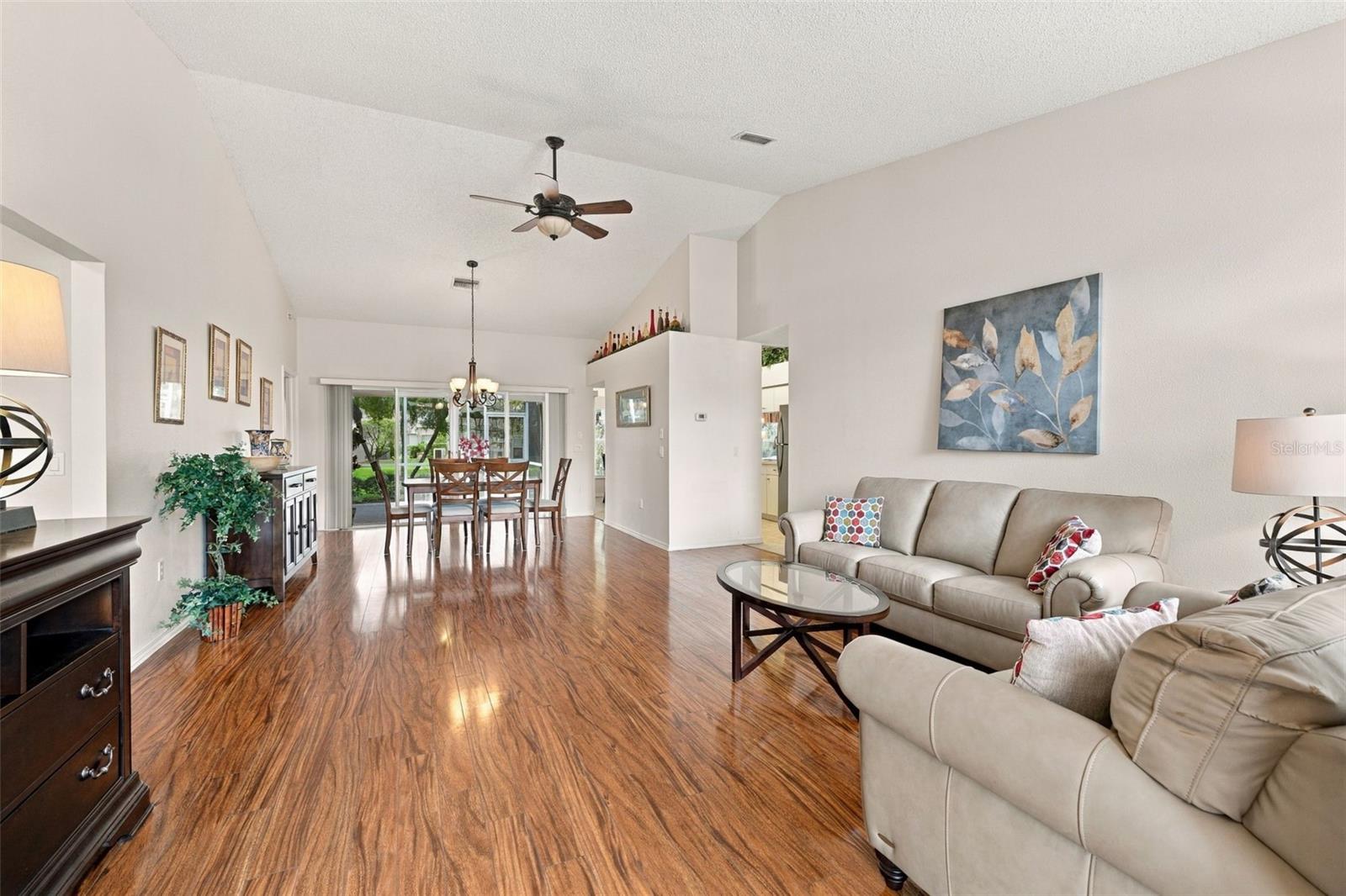 View as you enter the home with vaulted ceilings looking straight to the lanai