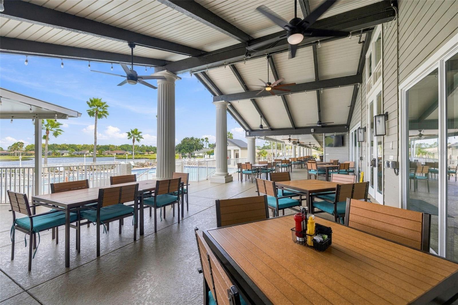Lots of outdoor/patio seating at the clubhouse overlooking the pool