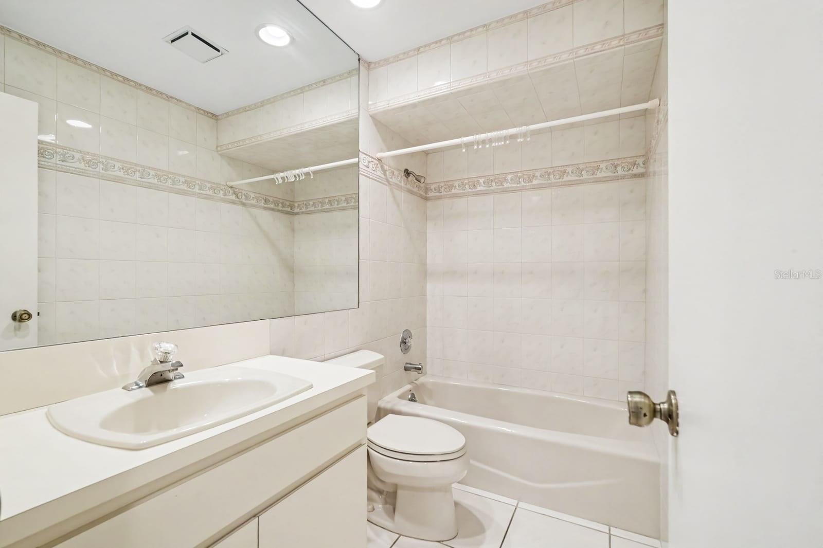 Master Bath with Vanity Sink, Tile Shower/Tub Combo & Decorative Tile Accent