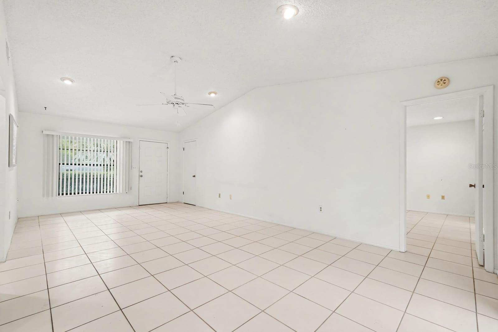 Spacious Room with Tile Flooring and Bright Natural Light from Windows