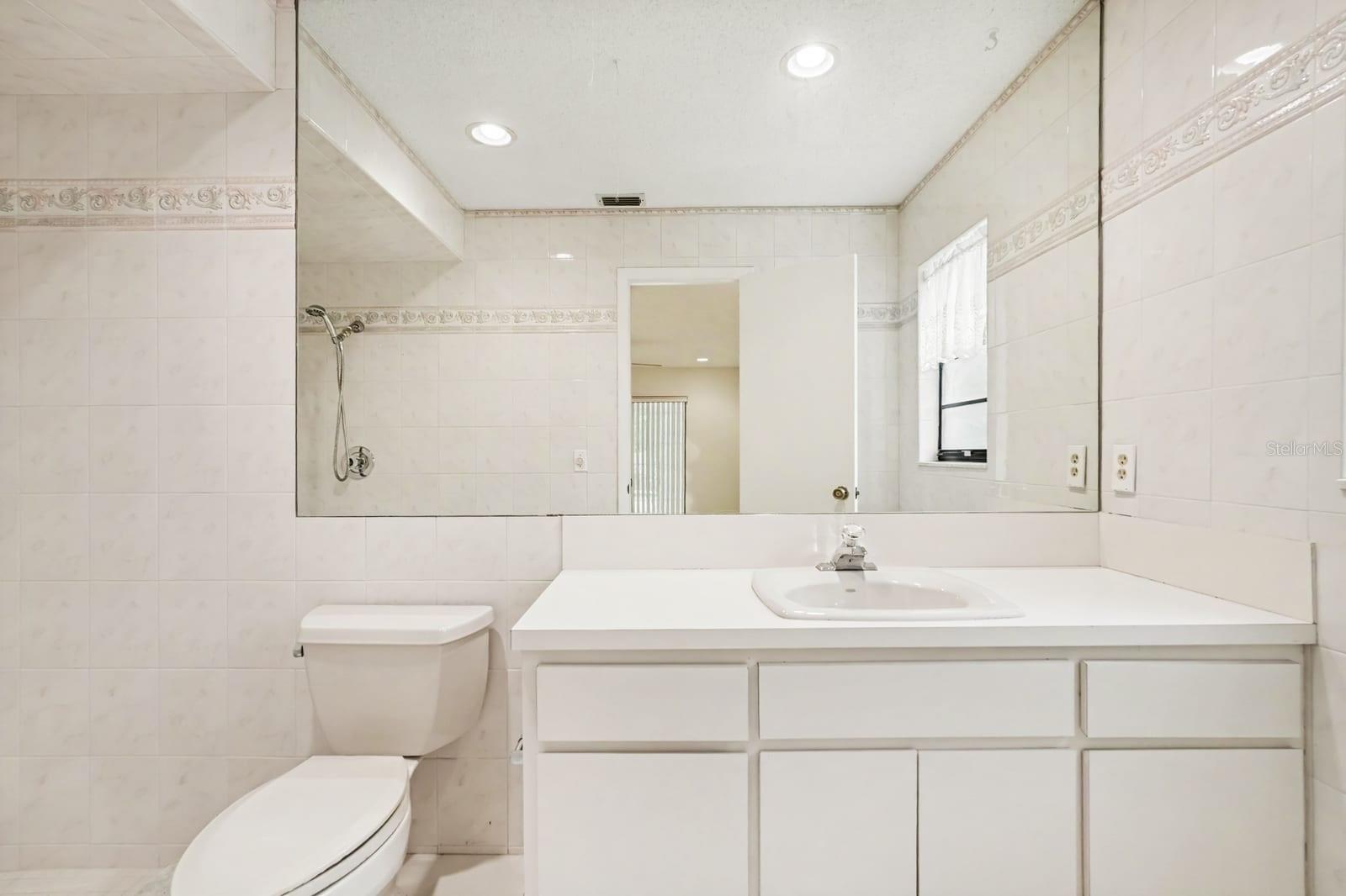 Elegant Master Bath with Vanity, Tile Work, and Walk-In Shower