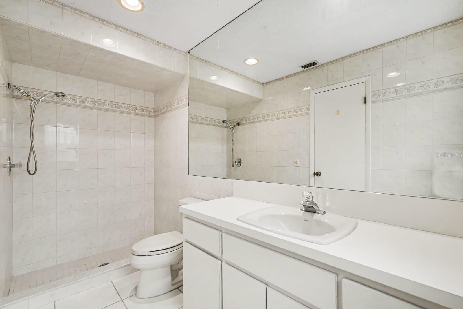 Master Bath with Large Mirror, Double Sink, and Separate Shower