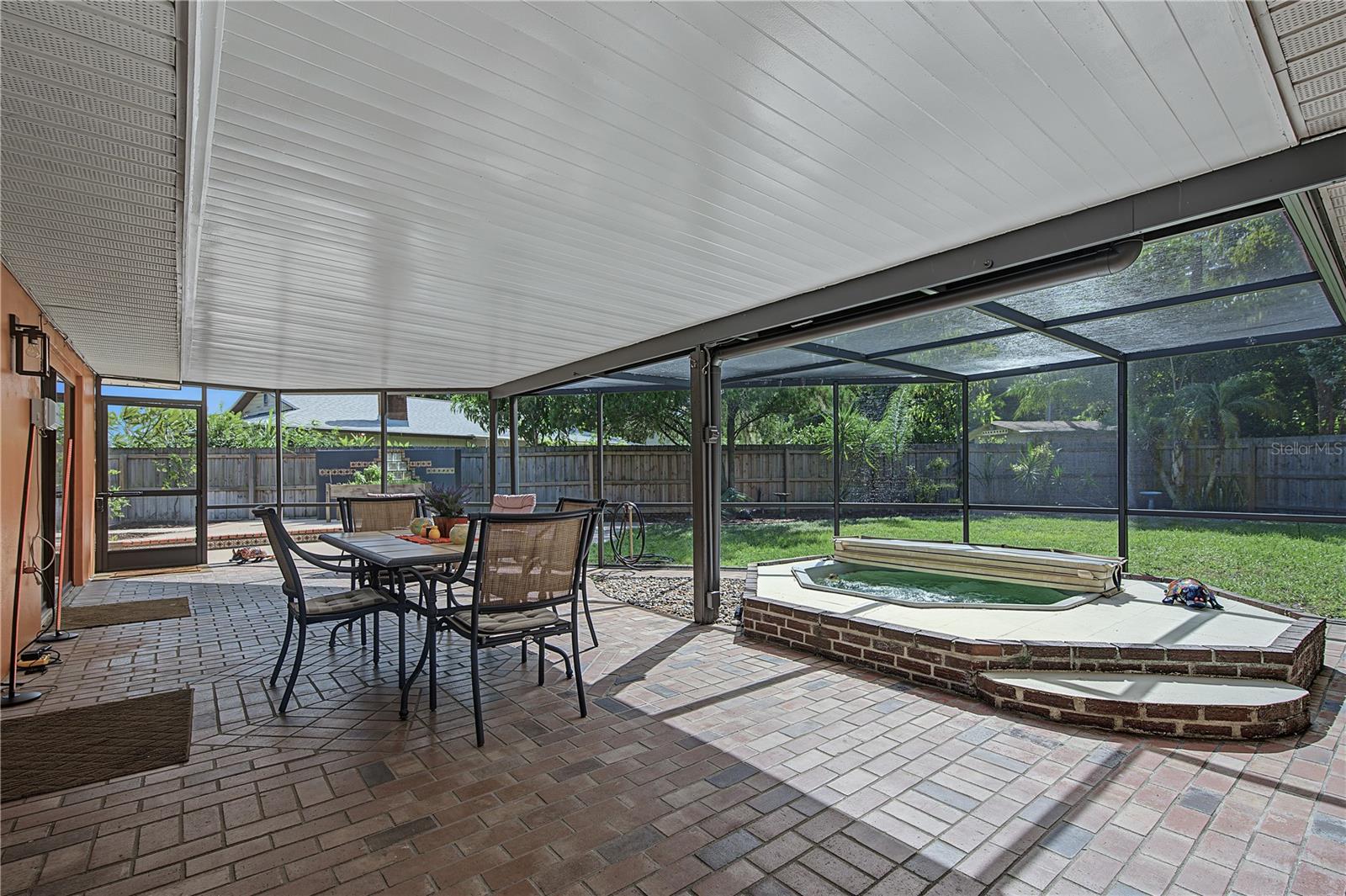 32. HUGE Enclosed, Covered, Screened Lanai w Brick Paved Flooring.. Hot Tub.. GREAT VIEW of Your PRIVATE Backyard!