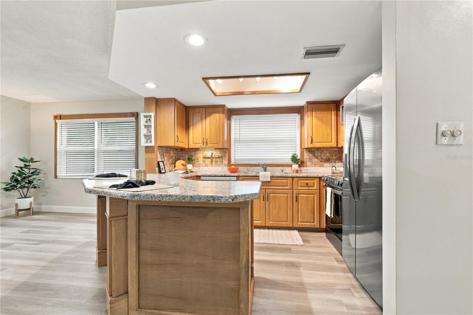 50. Updated Kitchen (9.4 x 12.2') Counter Depth Fridge Keeps the Entry Wide for Multiple Cooks to Enter the Kitchen!